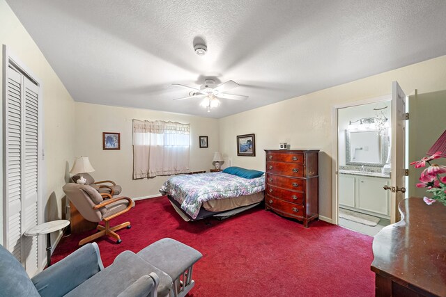 8105 Miller Dr, Hitchcock, TX 77563 - carpeted bedroom with ceiling fan, ensuite bath, a closet, and a textured ceiling
