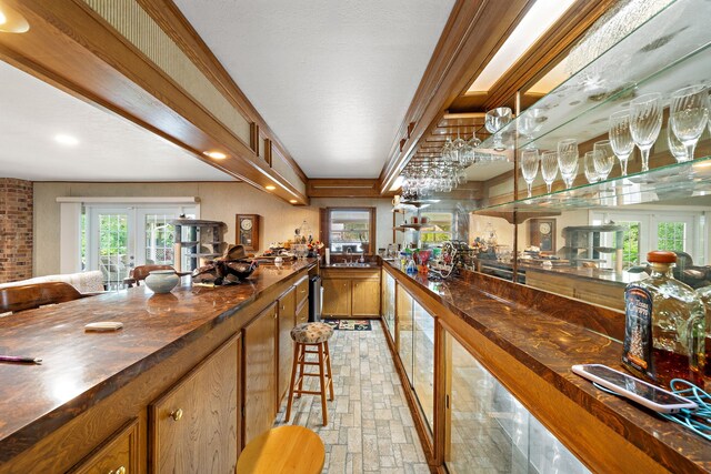 8105 Miller Dr, Hitchcock, TX 77563 - indoor bar featuring french doors and brick patterned floors