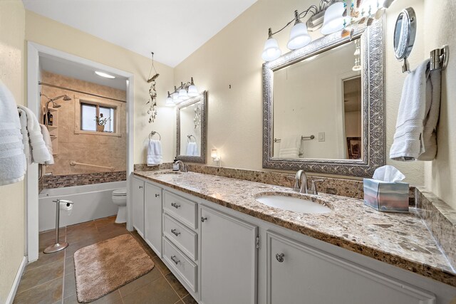 8105 Miller Dr, Hitchcock, TX 77563 - bathroom with double vanity, tile patterned flooring, and tub / shower combination