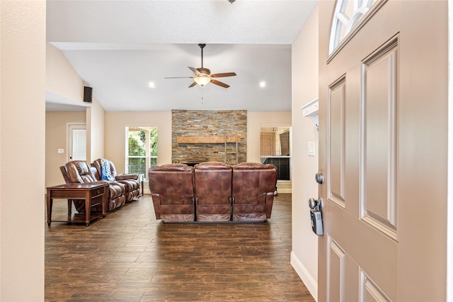 2546 Anzalone Dr, Spring, TX 77373 - living room with ceiling fan, lofted ceiling, dark wood-style floors, and a fireplace