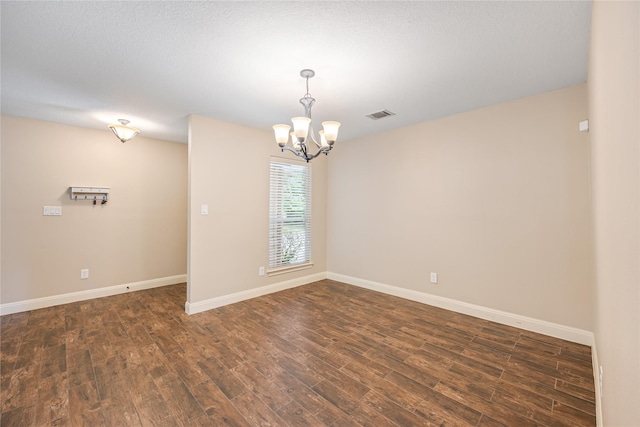 2546 Anzalone Dr, Spring, TX 77373 - unfurnished room featuring a chandelier and dark wood-type flooring