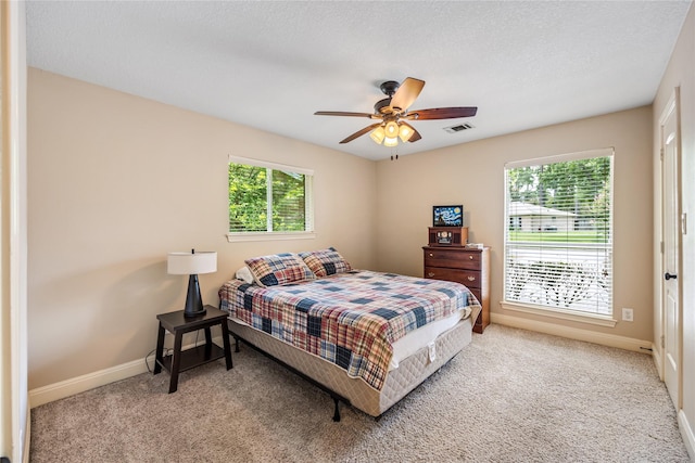 2546 Anzalone Dr, Spring, TX 77373 - carpeted bedroom with multiple windows and ceiling fan