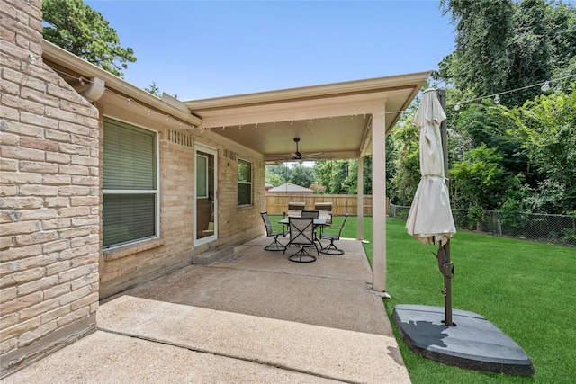 2546 Anzalone Dr, Spring, TX 77373 - fenced backyard with a ceiling fan, a patio area, and outdoor dining area