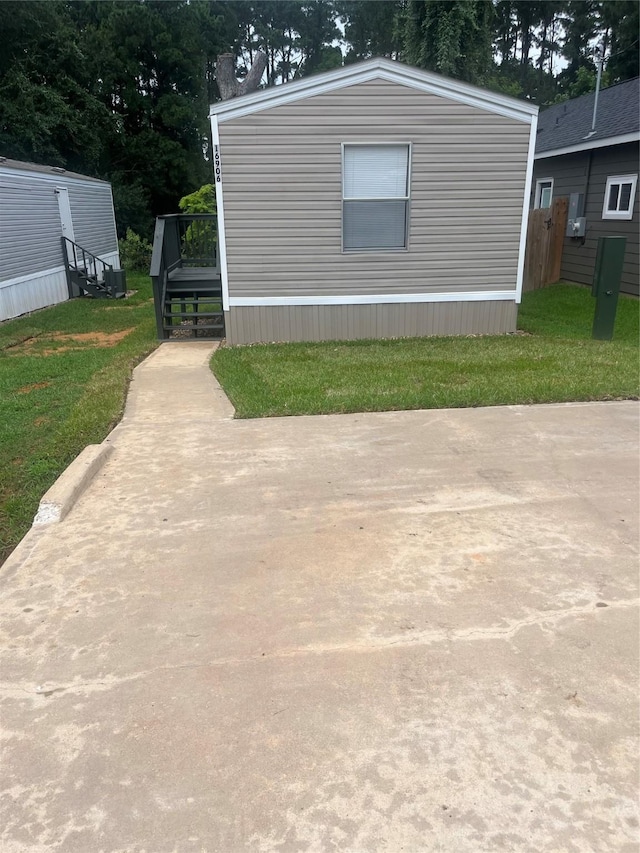 16906 Balmoral, Montgomery, TX 77316 - view of property exterior with a deck and a lawn