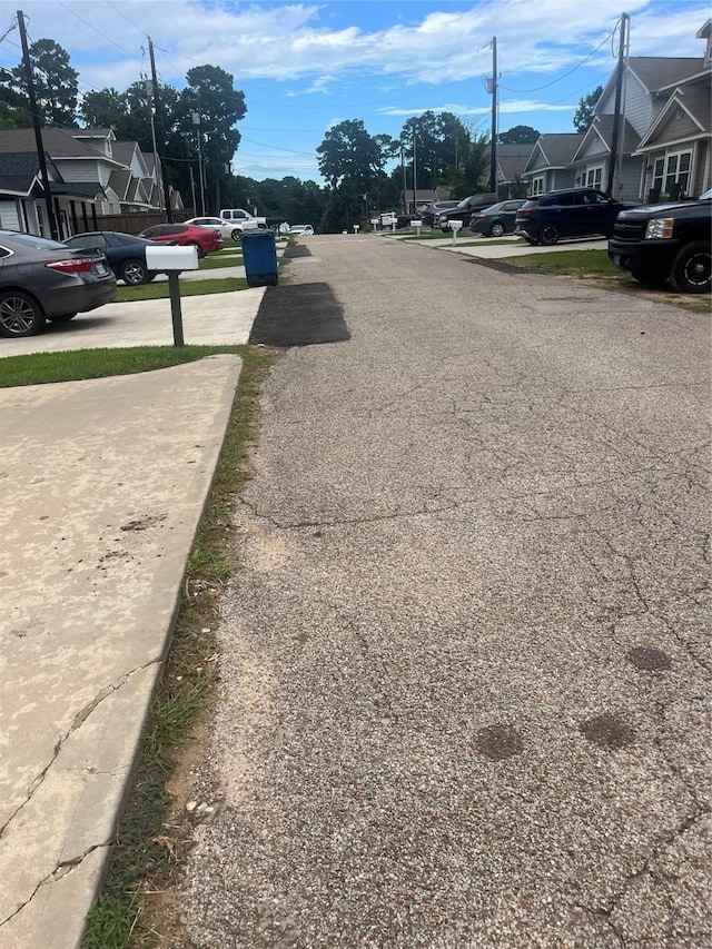 16906 Balmoral, Montgomery, TX 77316 - view of asphalt road with a residential view