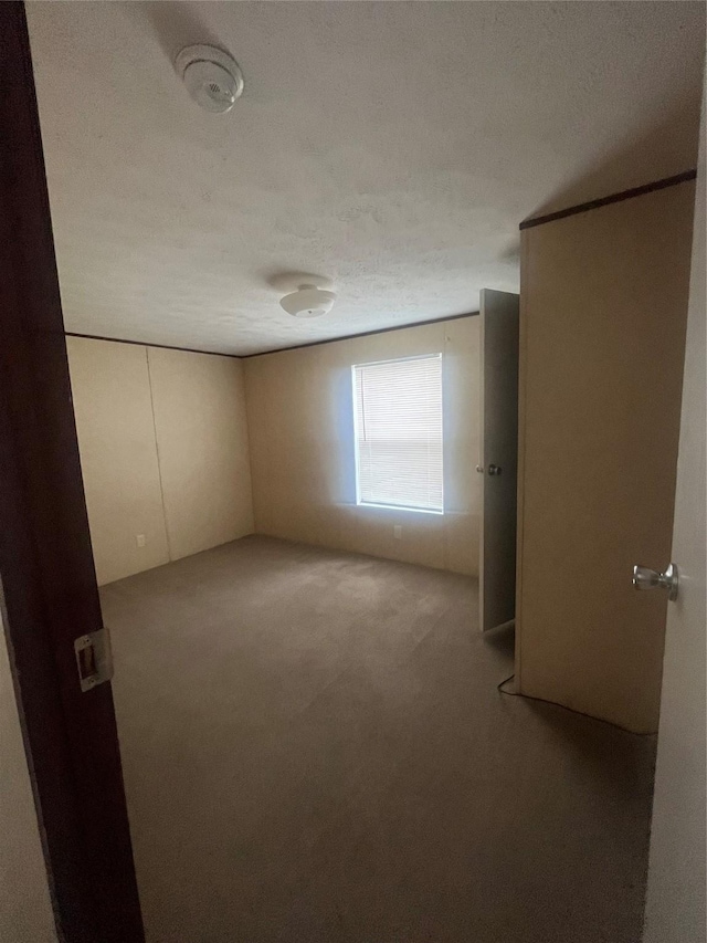 16906 Balmoral, Montgomery, TX 77316 - carpeted empty room featuring a smoke detector