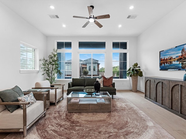 5240 Cornish Unit B, Houston, TX 77007 - living area with healthy amount of natural light, recessed lighting, wood finished floors, and a ceiling fan
