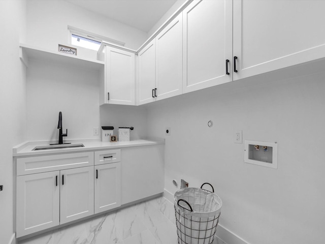 5240 Cornish Unit B, Houston, TX 77007 - laundry area with cabinet space, washer hookup, gas dryer hookup, light marble finish floors, and electric dryer hookup