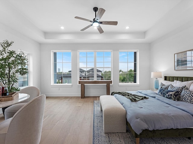 5240 Cornish Unit B, Houston, TX 77007 - bedroom with a tray ceiling, light wood-type flooring, recessed lighting, and ceiling fan