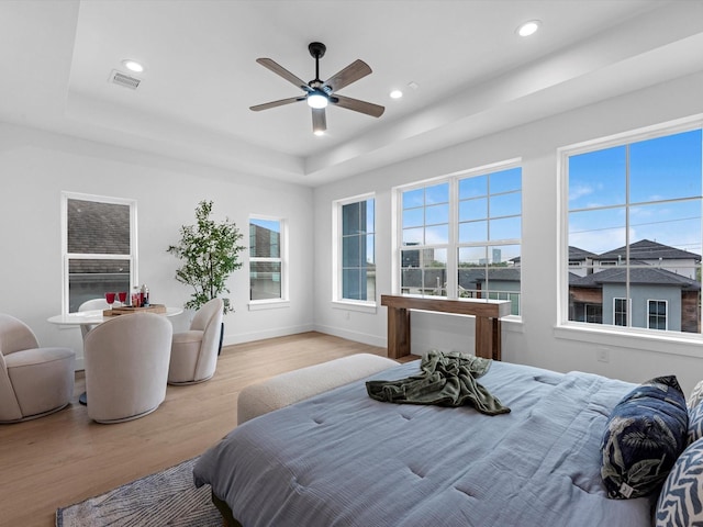 5240 Cornish Unit B, Houston, TX 77007 - bedroom with a tray ceiling, wood finished floors, recessed lighting, and a ceiling fan