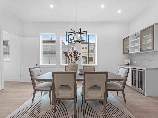 5240 Cornish Unit B, Houston, TX 77007 - dining area with wine cooler, light wood finished floors, plenty of natural light, and recessed lighting
