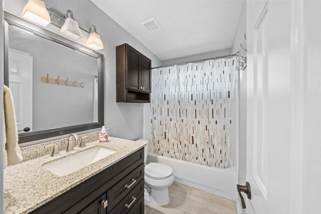 5207 Caprock Dr, Pearland, TX 77584 - bathroom featuring vanity, shower / bath combo, and tile patterned flooring