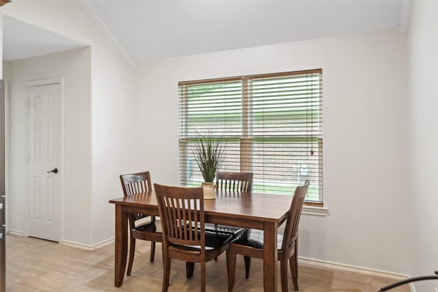 5207 Caprock Dr, Pearland, TX 77584 - dining space featuring plenty of natural light, lofted ceiling, and crown molding