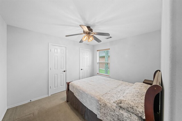 5207 Caprock Dr, Pearland, TX 77584 - bedroom with light carpet and a ceiling fan
