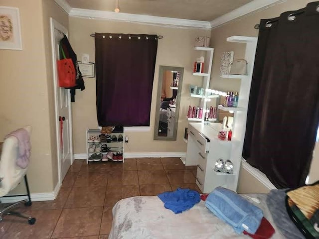 1902 July St, Houston, TX 77093 - bedroom with dark tile patterned floors and crown molding