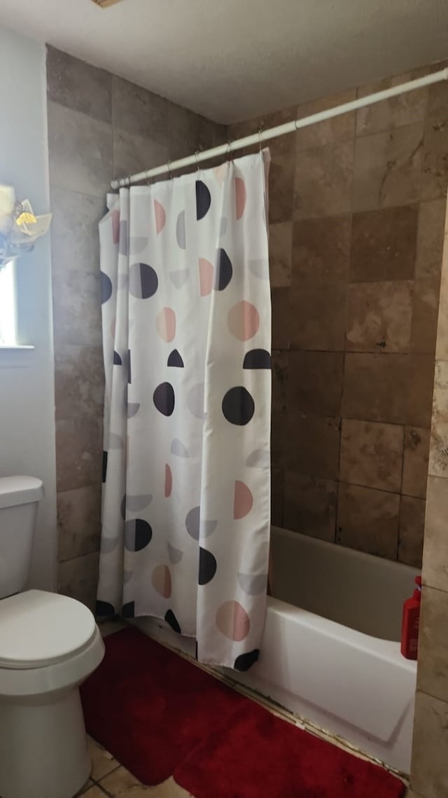 1902 July St, Houston, TX 77093 - full bath featuring shower / bath combination with curtain and tile patterned floors