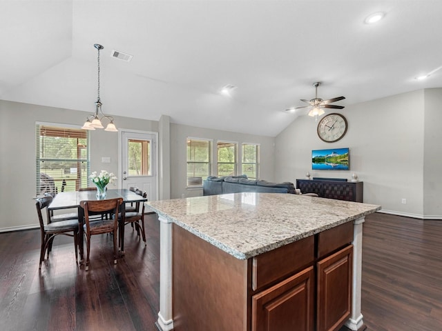 70 Rd 22705, Cleveland, TX 77327 - kitchen featuring lofted ceiling, dark wood-style flooring, a ceiling fan, a center island, and hanging light fixtures