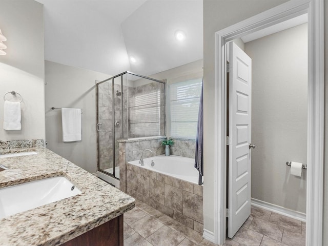 70 Rd 22705, Cleveland, TX 77327 - bathroom featuring a stall shower, tiled tub, tile patterned flooring, double vanity, and lofted ceiling