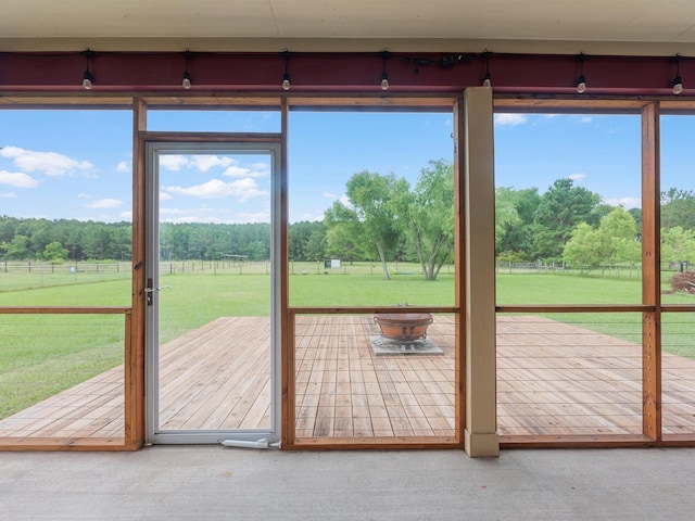 70 Rd 22705, Cleveland, TX 77327 - doorway featuring a rural view, view of wooded area, and carpet