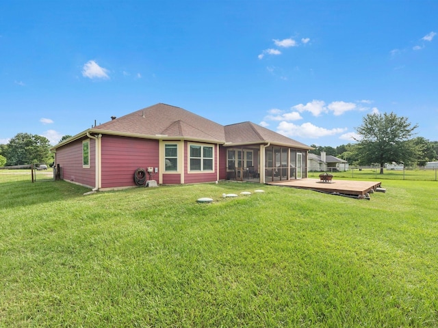 70 Rd 22705, Cleveland, TX 77327 - back of house featuring a sunroom, a wooden deck, and roof with shingles