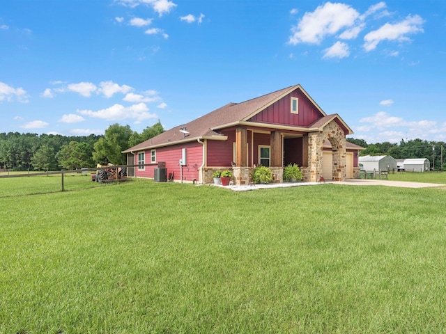 70 Rd 22705, Cleveland, TX 77327 - view of front of property featuring board and batten siding, concrete driveway, stone siding, and a garage