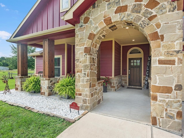 70 Rd 22705, Cleveland, TX 77327 - entrance to property with stone siding, board and batten siding, and a porch