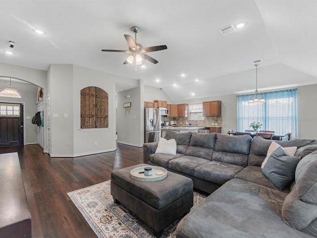 70 Rd 22705, Cleveland, TX 77327 - living area featuring vaulted ceiling, a ceiling fan, a chandelier, arched walkways, and dark wood finished floors