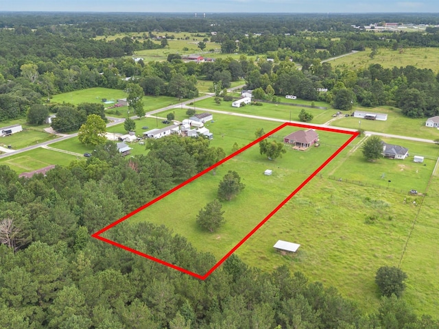 70 Rd 22705, Cleveland, TX 77327 - aerial view of property and surrounding area featuring property boundaries highlighted and a forest