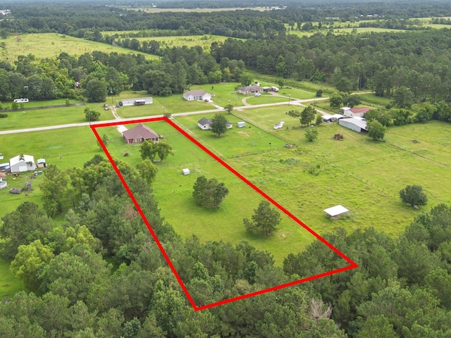70 Rd 22705, Cleveland, TX 77327 - aerial view of sparsely populated area with property parcel outlined and a forest