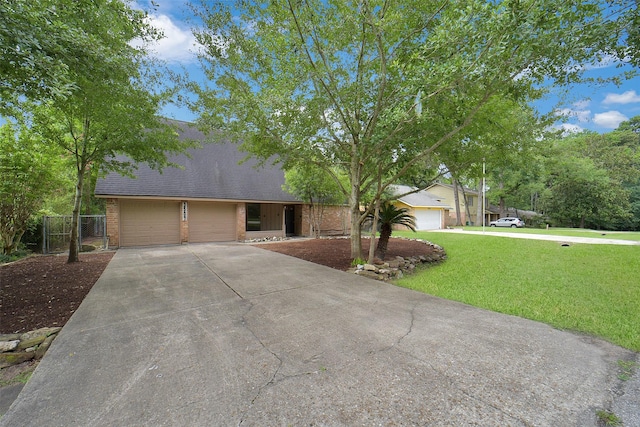 3507 Dawnwood Dr, Spring, TX 77380 - view of front of home with driveway, brick siding, and roof with shingles