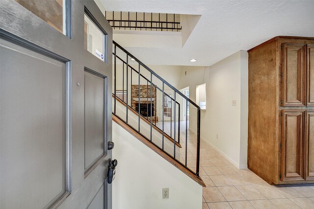 3507 Dawnwood Dr, Spring, TX 77380 - foyer with light tile patterned floors and stairway