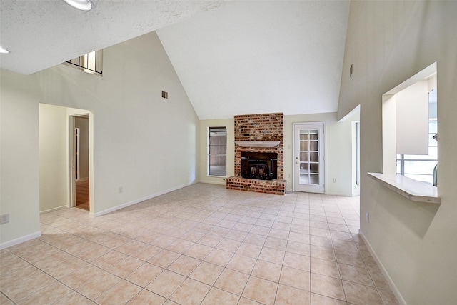 3507 Dawnwood Dr, Spring, TX 77380 - unfurnished living room with high vaulted ceiling, light tile patterned flooring, and a brick fireplace