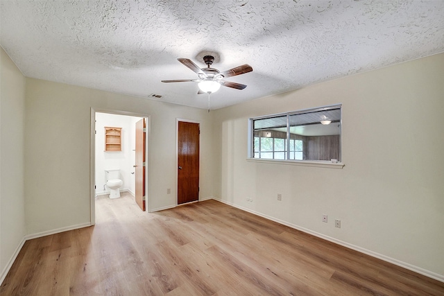 3507 Dawnwood Dr, Spring, TX 77380 - unfurnished bedroom with wood finished floors, a textured ceiling, ensuite bath, and ceiling fan