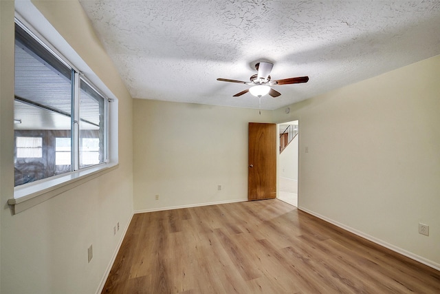 3507 Dawnwood Dr, Spring, TX 77380 - spare room featuring wood finished floors, a ceiling fan, and a textured ceiling