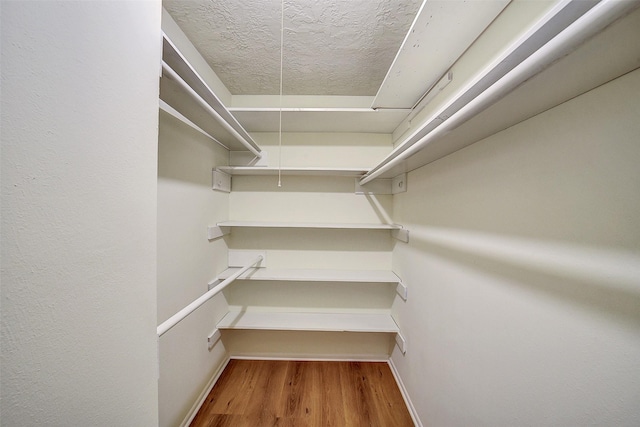 3507 Dawnwood Dr, Spring, TX 77380 - walk in closet with wood finished floors