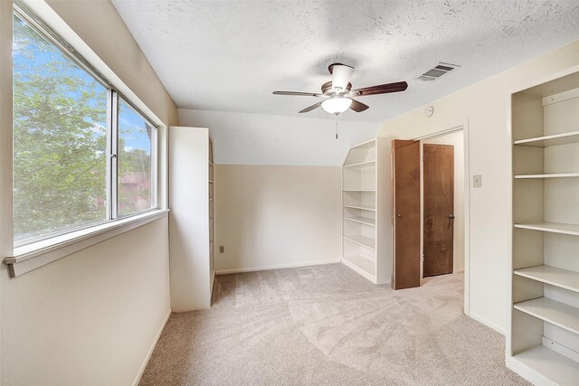 3507 Dawnwood Dr, Spring, TX 77380 - unfurnished bedroom with carpet floors, a textured ceiling, and ceiling fan
