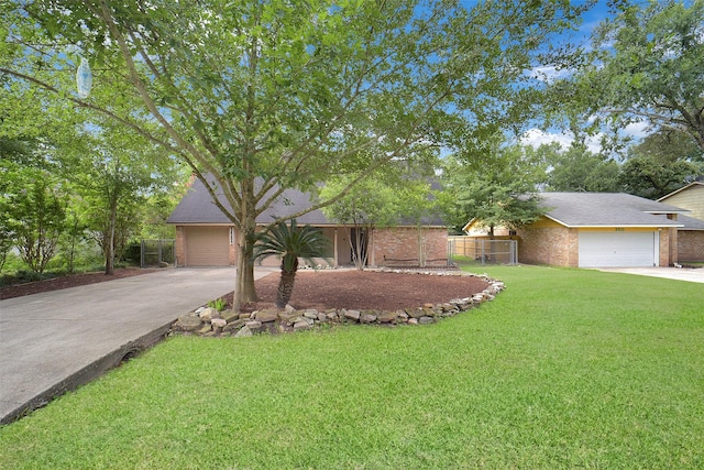 3507 Dawnwood Dr, Spring, TX 77380 - view of front of property with driveway, an attached garage, brick siding, and a shingled roof