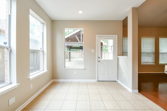 14307 Baron Creek Ln, Houston, TX 77044 - entryway with baseboards and light tile patterned floors