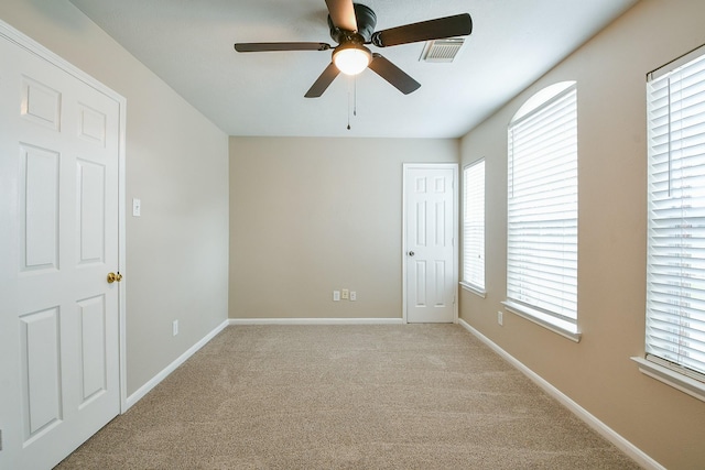 14307 Baron Creek Ln, Houston, TX 77044 - carpeted spare room featuring a ceiling fan and baseboards
