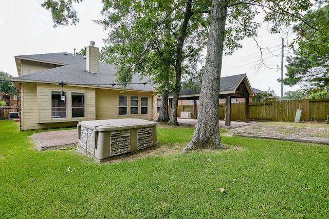 14307 Baron Creek Ln, Houston, TX 77044 - back of house featuring a gazebo, a patio, a chimney, and roof with shingles
