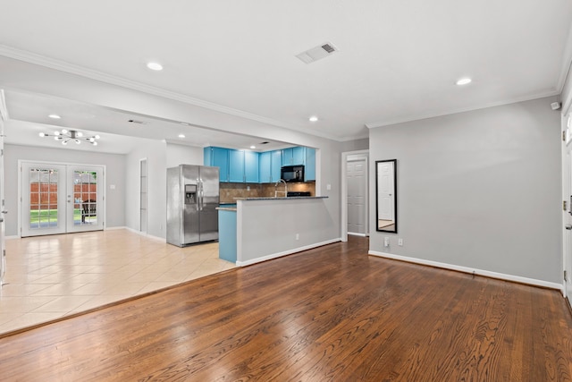 5110 Verdome Ln, Houston, TX 77092 - unfurnished living room with recessed lighting, a chandelier, crown molding, and light wood-style flooring