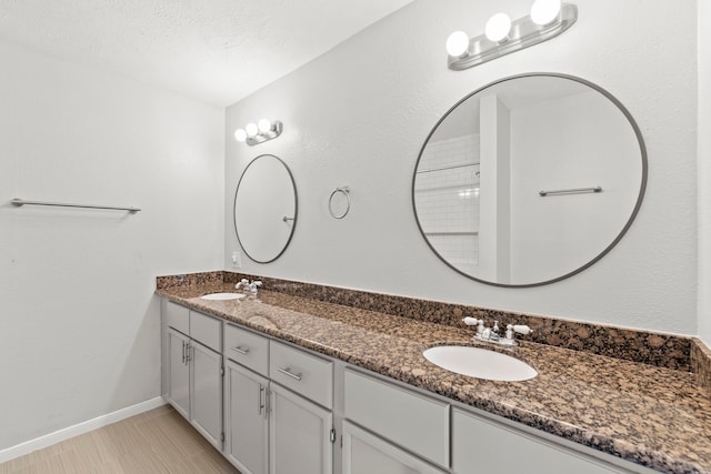 5110 Verdome Ln, Houston, TX 77092 - bathroom with double vanity and baseboards