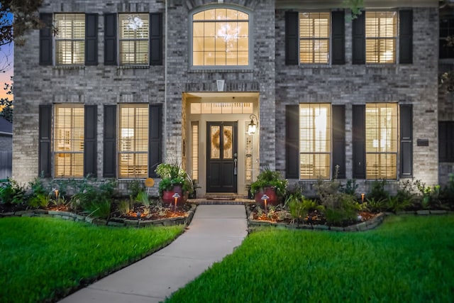 4502 Buffalo Lake Ct, Richmond, TX 77406 - view of exterior entry featuring a lawn