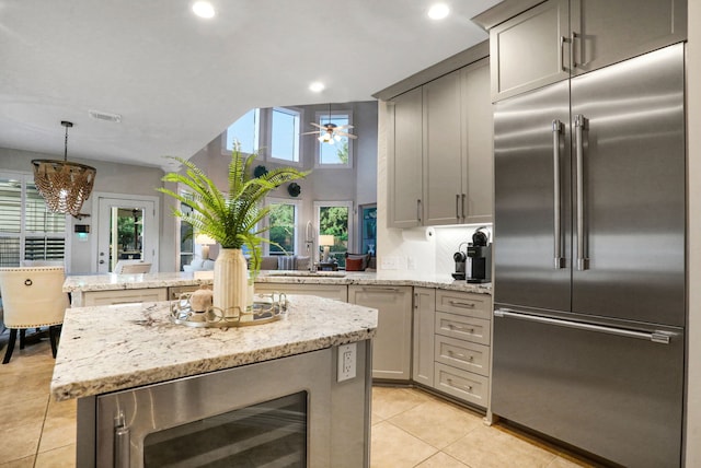 4502 Buffalo Lake Ct, Richmond, TX 77406 - kitchen featuring stainless steel built in fridge, wine cooler, light tile patterned flooring, a peninsula, and ceiling fan