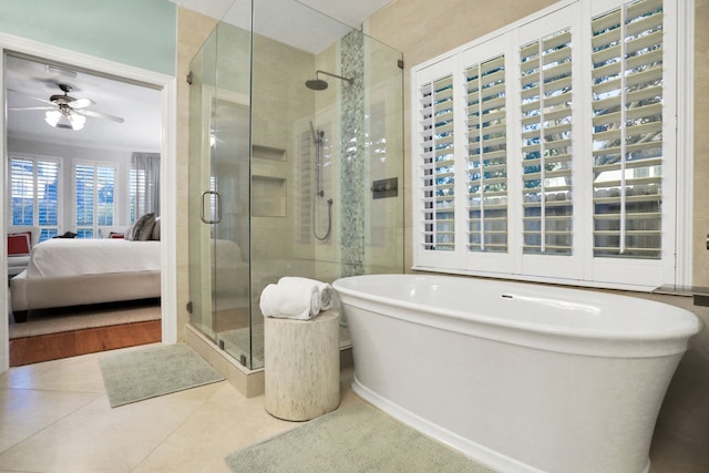 4502 Buffalo Lake Ct, Richmond, TX 77406 - ensuite bathroom featuring a shower stall, a freestanding bath, tile patterned floors, and ceiling fan