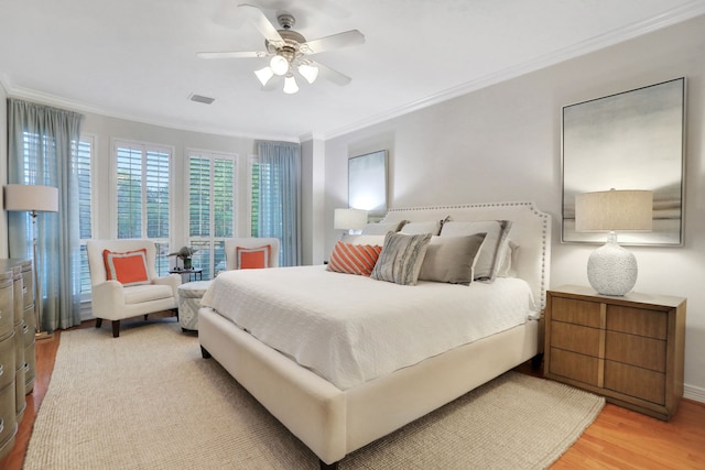 4502 Buffalo Lake Ct, Richmond, TX 77406 - bedroom with crown molding, light wood-type flooring, and ceiling fan
