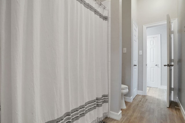4502 Buffalo Lake Ct, Richmond, TX 77406 - full bath with wood finished floors and a shower with shower curtain