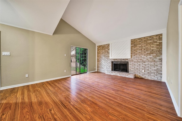 6401 Deihl Rd Unit 901, Houston, TX 77092 - unfurnished living room with wood finished floors, a fireplace, and high vaulted ceiling