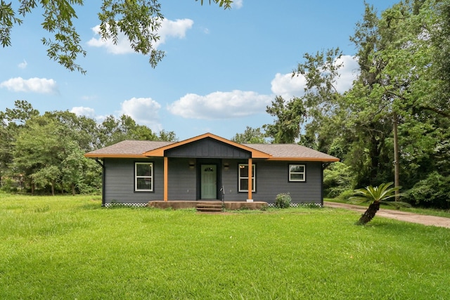 16820 Laurelwood Dr, Channelview, TX 77530 - view of front of house featuring a porch and a front yard