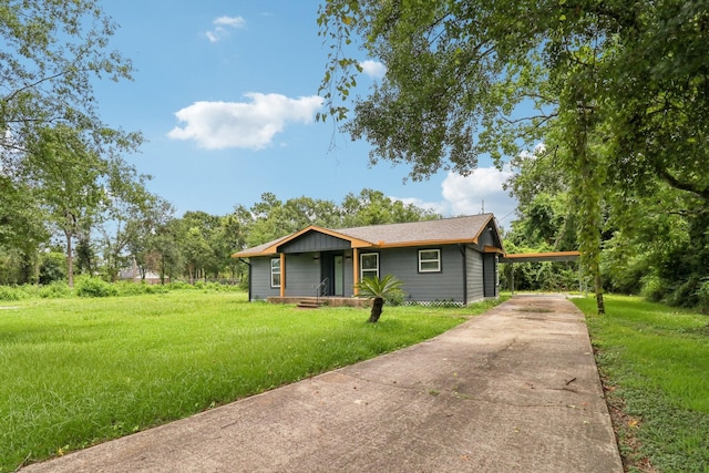 16820 Laurelwood Dr, Channelview, TX 77530 - view of front facade with driveway and a front yard